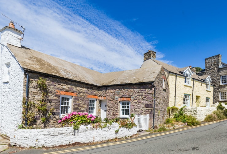 Old, colourful, stone cottages in St Davids, Wales.