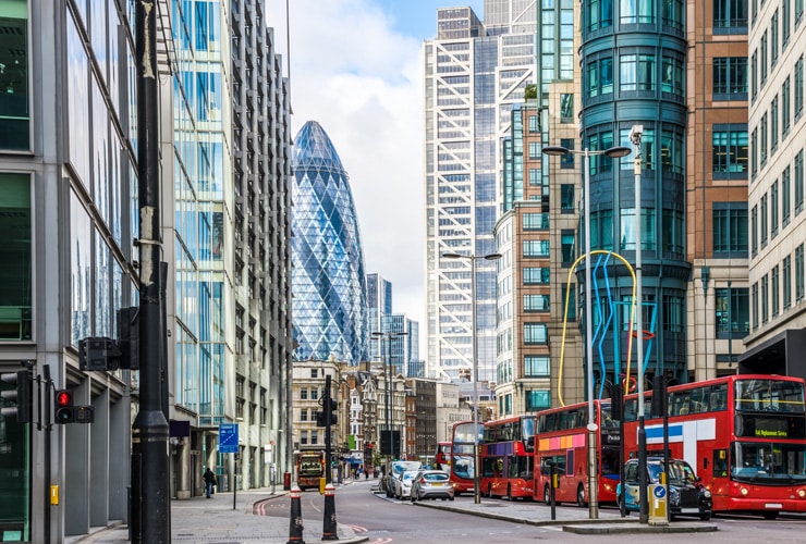 Liverpool Street - A busy street in the centre of London with the Gherkin in the background.