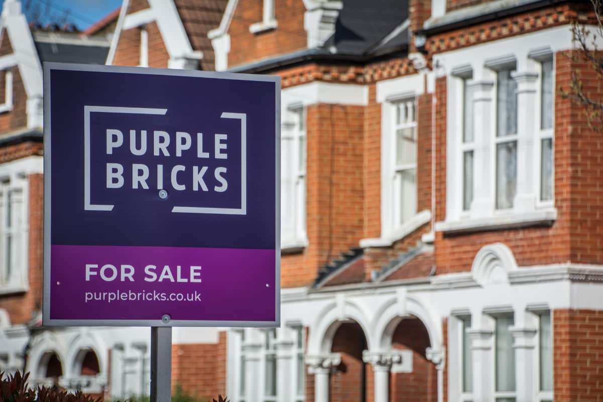 A Purple Bricks branded for say sign in front of a Georgian house.