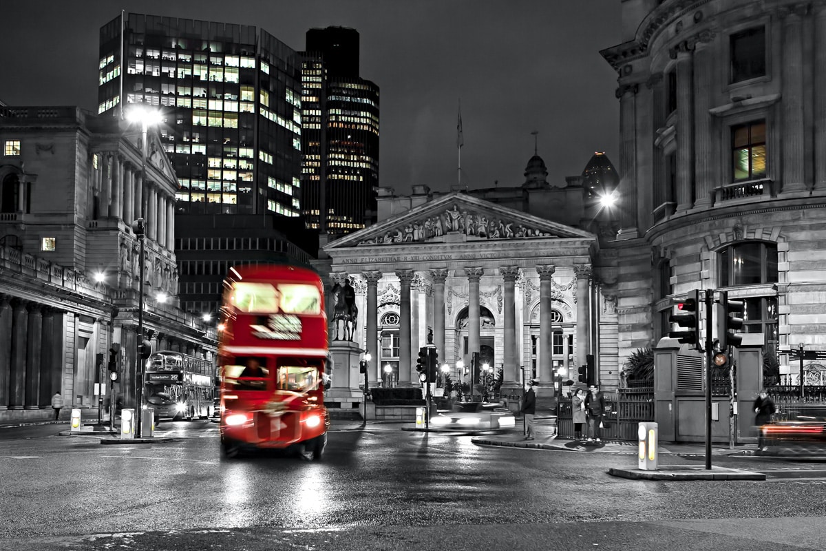 The Royal Exchange London. A red route master bus, in front of the Bank of England.