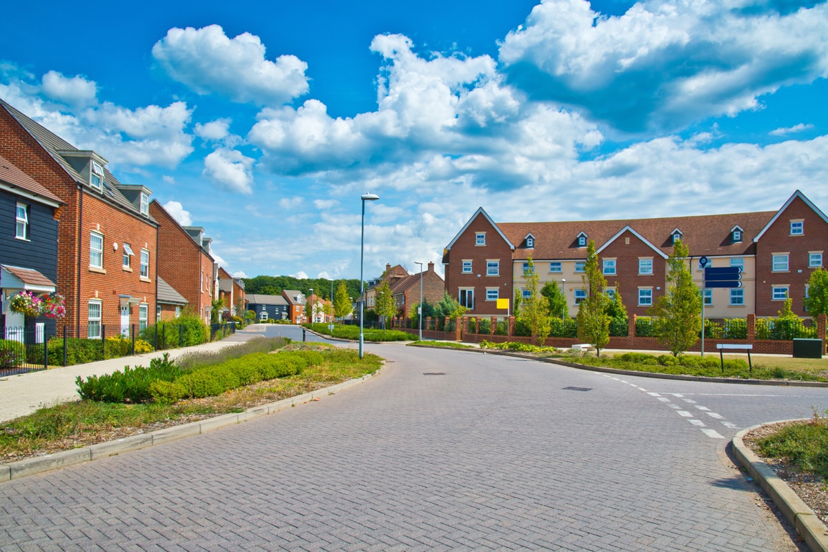 A new-build English housing estate on a bright summer's day.