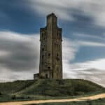 An old tower sat on a hull in Yorkshire. Photo of Castle Hill in Huddersfield.