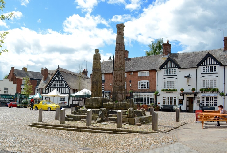 A memorial with a pub in the background. The market town of Sandbach in the county of Cheshire.