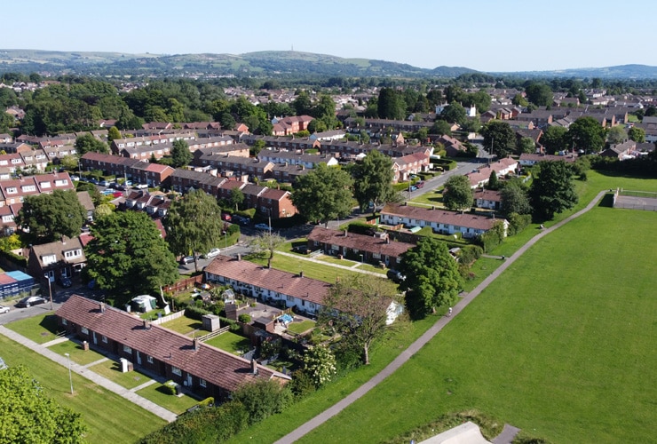 An aerial view of a housing estate next to a park. Photograph of the Western Estate in Macclesfield.