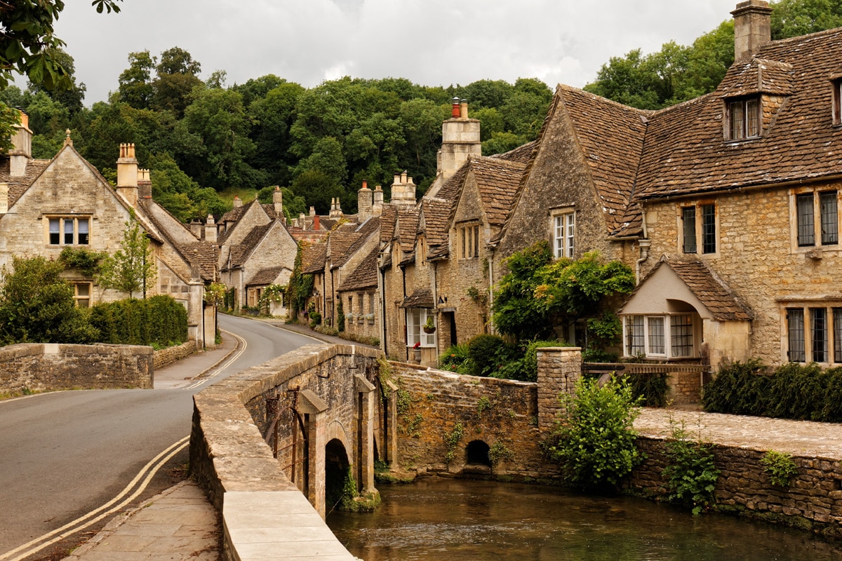 A rustic, old-world English village. The high street in Castle Combe, Wiltshire.