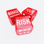 Three dice. On the first it says, 'manage', on the second, 'your' and on the thrid, 'risk'.