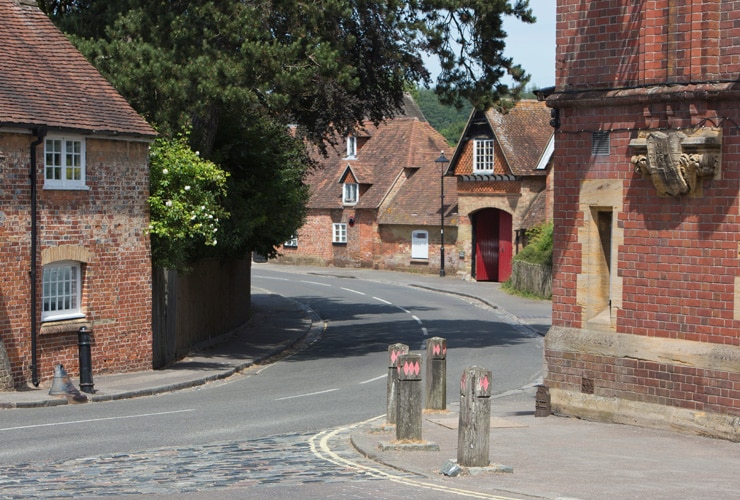 Architecture in the historic and beautiful Beaulieu village in the New Forest area of Hampshire, England, UK, showing ancient brick and timber houses with a herringbone pattern.