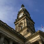 Looking upwards at the clock tower of Bolton Town Hall.