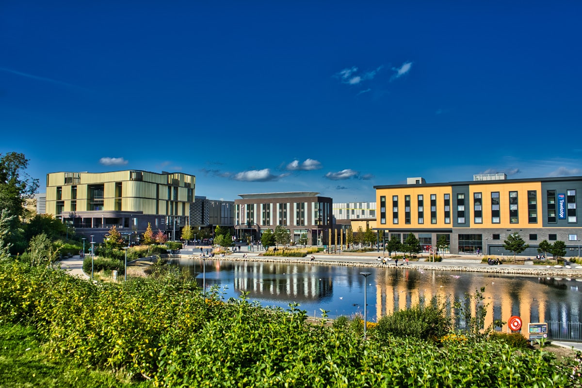 Commercial buildings round a small lake in Telford town centre.