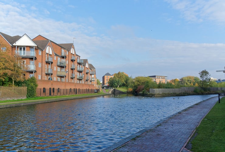 Residential flats sit alongside the Walsall Canal.