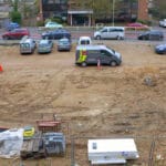 Cleared land, previously used for commercial purposes, now awaiting development. A brownfield site in Bracknell, England.