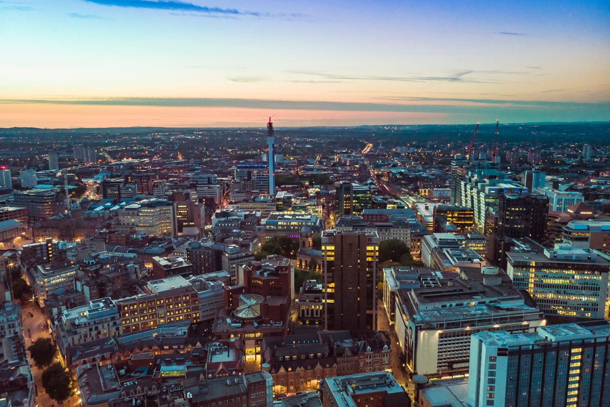 An aerial view of Birmingham city centre at sunrise.