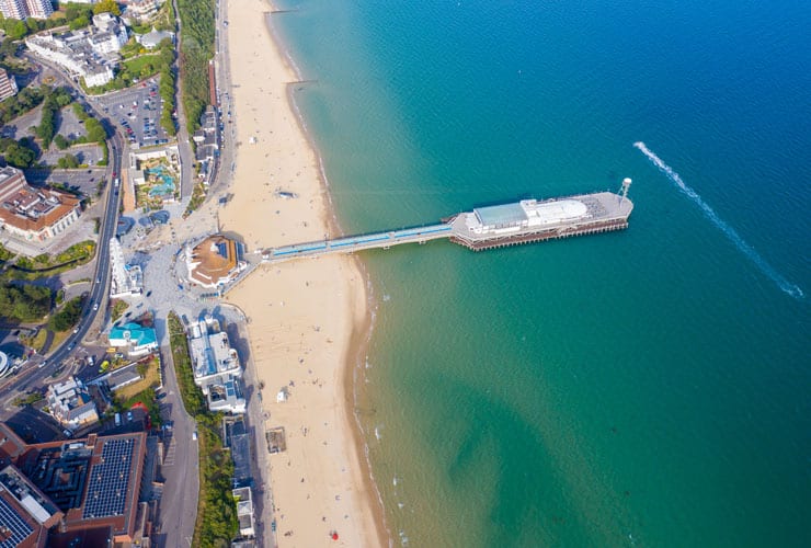 Aerial photo of Bournemouth beach including the Observation Wheel and Pier.