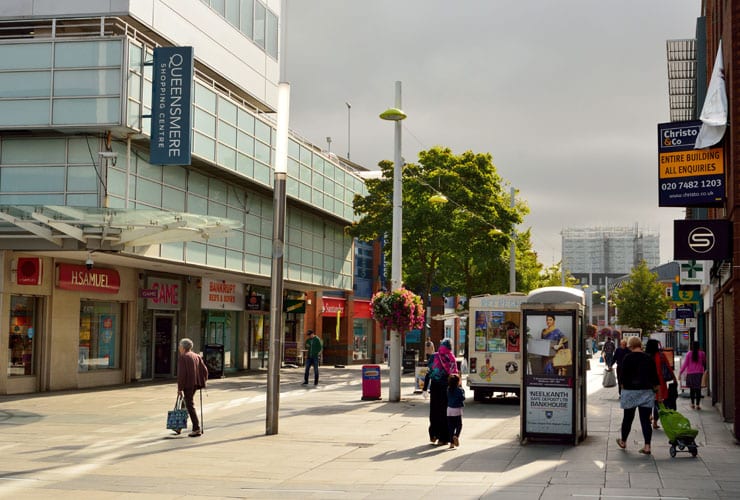 View of High Street in Slough with historic buildings and commercial properties.