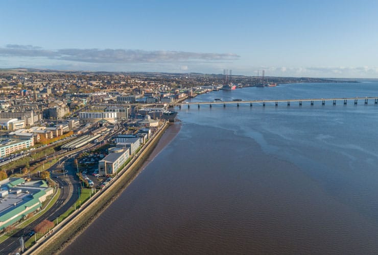 Drone image of River Tay estuary at Dundee showing Dundee waterfront and Tay Road Bridge.