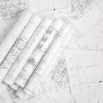 A pile of architectural drawings.