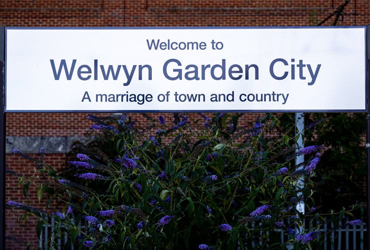 A sign that says, Welcome to Welwyn Garden City. A marriage of town and country.