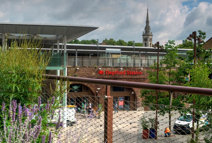 View of Deptford Railway Station across a redeveloped pedestrian area.