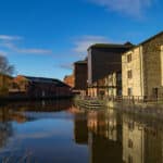 Old buildings on the side of the Leeds/ Liverpool Canal in Wigan.