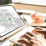 An icon showing a clipboard and a hand with a pen. Image represents a home survey.