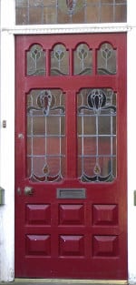 A red door, typical of an Edwardian house.