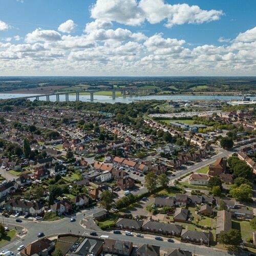 An aerial view of Ipswich on a summer day. Clouds in the sky and the bridge and river in the background