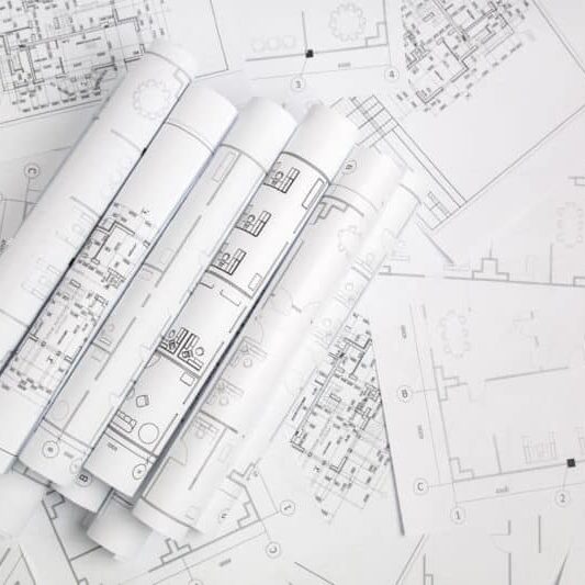 A pile of architectural drawings.