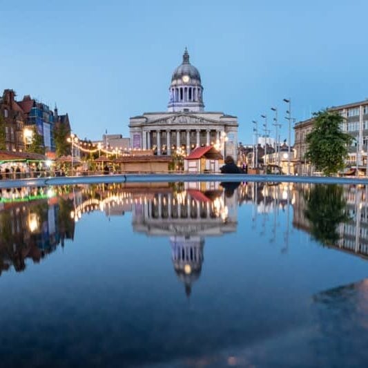 Council House also known as the city hall in the Old Market Square with a pool and fountain in the foreground, Nottingham.