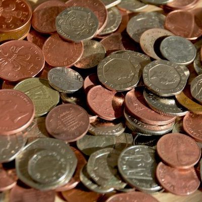 Pile of Coins. UK Currency. Property Investments UK. Contingency Budget. Buy to let landlord tip. Property investor tip